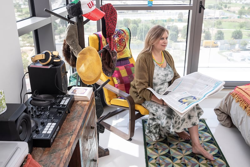 Ananda Shakespeare in her apartment in Damac Hills. She pays Dh25,000 for the single-room studio, which she says is the lowest rent she has paid in 17 years in Dubai. All photos by Antonie Robertson / The National
