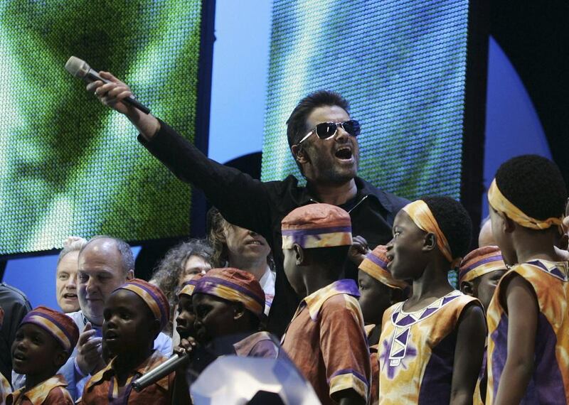 George Michael accompanied by other musicians and children from Africa performing for the finale of the Live 8 concert in Hyde Park, London, on July 2, 2005. AP