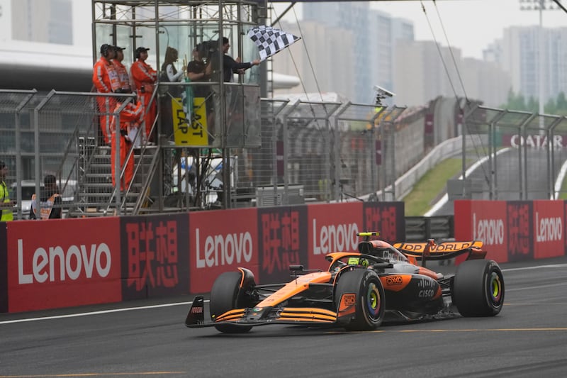 McLaren driver Lando Norris crosses the finish line to finish second. AP
