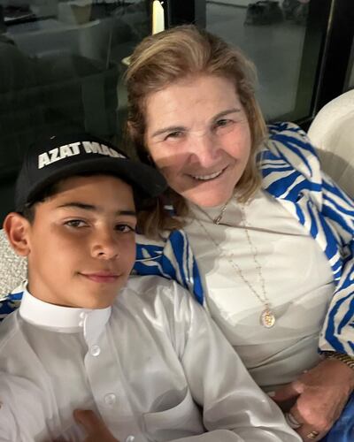 Cristiano Jr wearing a traditional Saudi-style thobe and his grandmother. Photo: Maria Dolores dos Santos Aveiro / Instagram
