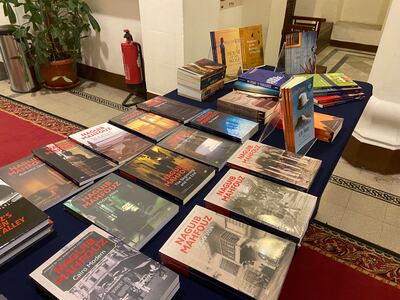 The English translations of Naguib Mahfouz books, alongside past winners of the AUC’s Naguib Mahfouz Medal for Literature. Nada El Sawy / The National