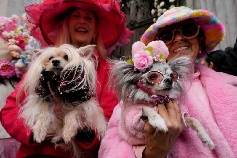 Leslie and her dog, Puccini, and Joanna and her dog, Chichi Love, take part in the annual Easter Parade and Bonnet Festival outside St Patrick's Cathedral, in New York City. Reuters