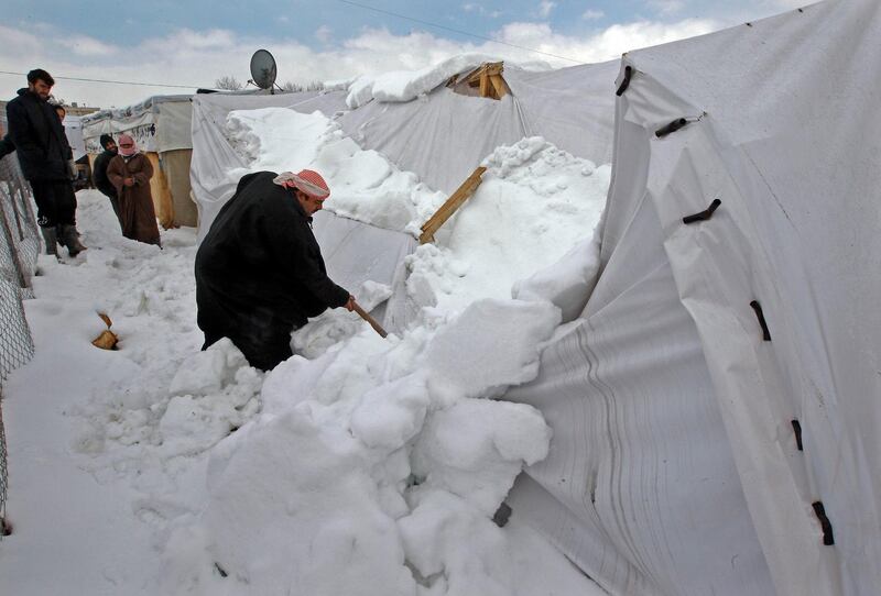 BEIRUT, LEBANON - JANUARY 09: Syrian refugees, fled their homes due to the civil war in their country, try to live under harsh living conditions at a refugee camp in Beirut, Lebanon on January 09, 2014. (Photo by Bilal Jawich/Anadolu Agency/Getty Images)