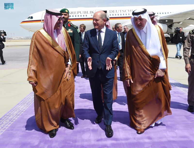 German Chancellor Olaf Scholz was met by Prince Khalid bin Faisal, Governor of Makkah Province, right, on his arrival in the Saudi Red Sea city of Jeddah. EPA