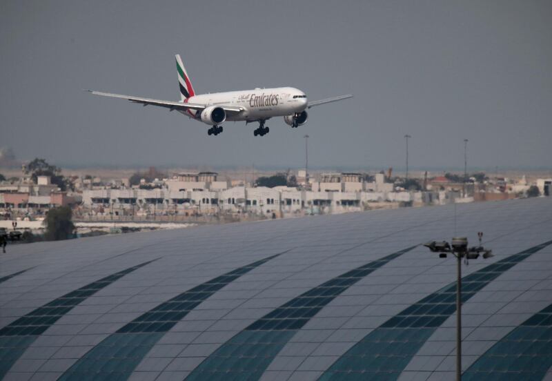 FILE PHOTO: An Emirates Airline Boeing 777-300ER plane lands at the Dubai International Airport in Dubai, United Arab Emirates February 15, 2019. REUTERS/Christopher Pike/File Photo