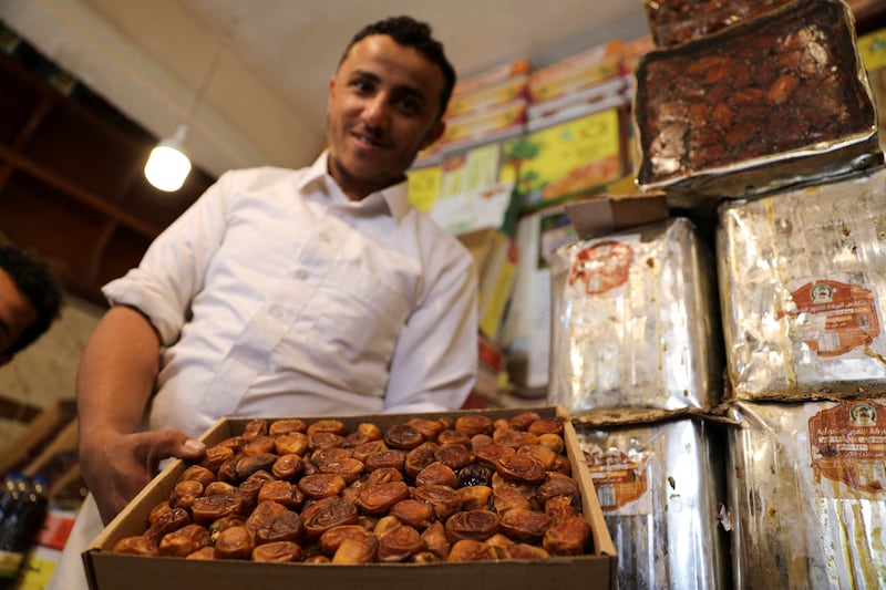 A vendor displays dates at his shop.