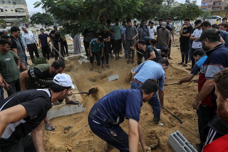 Palestinians who were killed are buried in Rafah, Gaza. Reuters