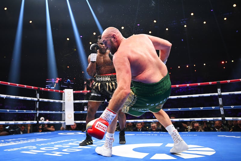 Francis Ngannou knocks down Tyson Furyin the third round of their bout in Riyadh. Getty