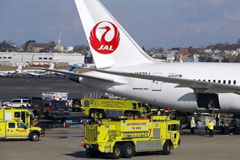 Fire trucks surround a Japan Airlines Boeing 787 Dreamliner that caught fire at Logan International Airport in Boston, Massachusetts. Brian Snyder / Reuters