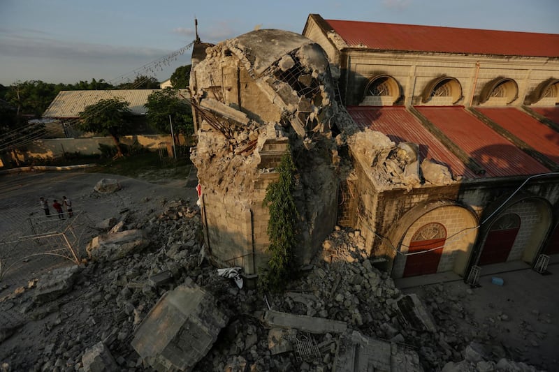 epa07522115 Site of the damaged St. Catherine Parish Church in Porac town, Pampanga Province, north of Manila, Philippines, 23 April 2019. A 6.1-magnitude earthquake occurred on 22 April in the Philippine region of Luzon with an epicenter located northeast of Zambales province, according to data from the Philippine Institute of Volcanology and Seismology (Phivolcs). According to latest data from the National Disaster Risk Reduction and Management Council (NDRRMC), at least seven people were killed, 81 were hurt and 24 are still missing.  EPA/FRANCIS R. MALASIG