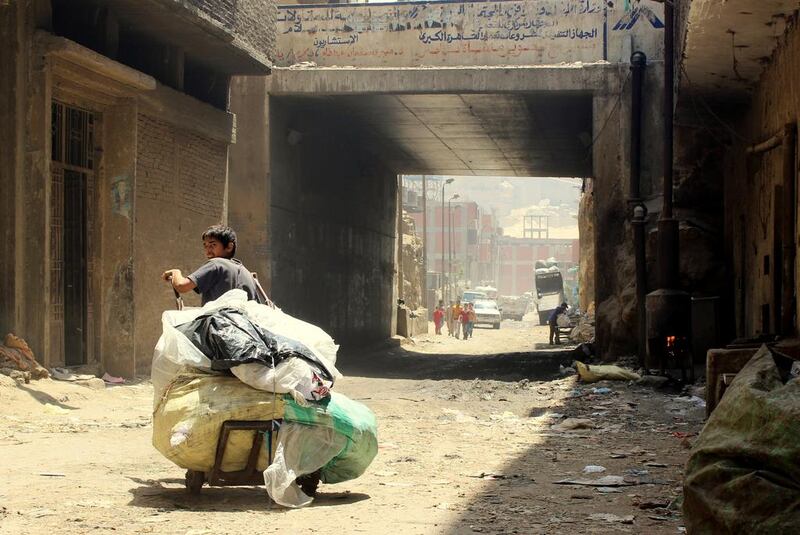 A boy at the main gate of the Manshiyat Naser slum in Cairo, leaving with his cart to the city to collect garbage. Sandor Jaszberenyi / The National