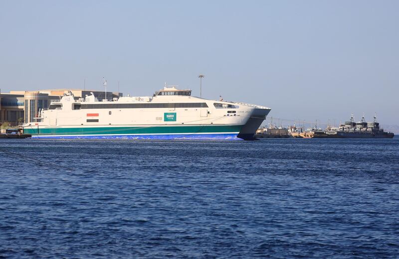 A ferry with Egyptian and Saudi Arabian flags is seen at Hurghada Maritime Port