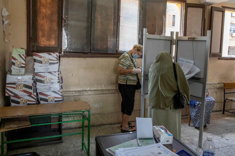 Women vote on the first day of the Senate elections. AP Photo