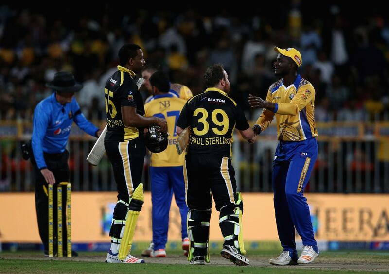 Players shake hands after the T10 League match between Bengal Tigers and Kerala Kings at Sharjah Cricket Stadium on December 14, 2017. Francois Nel/Getty Images