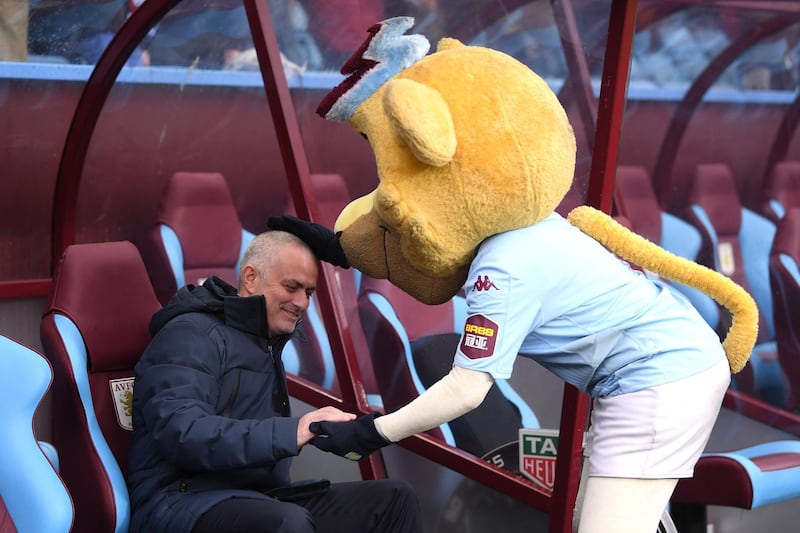 Jose Mourinho with the Aston Villa mascot. Getty