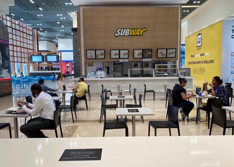 People eat in the food court at Dubai Mall on May 3, 2020. Reuters