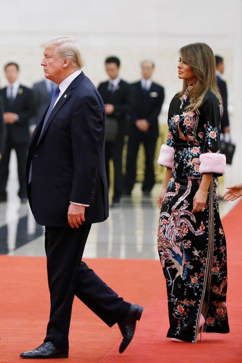 BEIJING, CHINA - NOVEMBER 9:  U.S. President Donald Trump and first lady Melania arrive for the state dinner at the Great Hall of the People on November 9, 2017 in Beijing, China. Trump is on a 10-day trip to Asia.  (Photo by Thomas Peter - Pool/Getty Images)