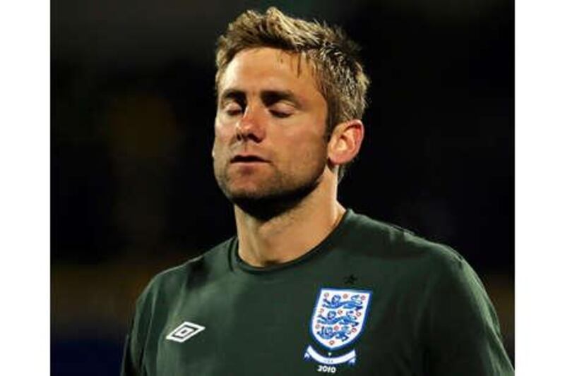Goalkeeper Robert Green reacts after conceding a goal against the US.