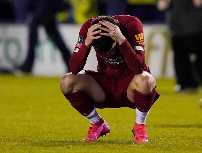 Liverpool's Curtis Jones looks dejected after the match finished 2-2. Reuters