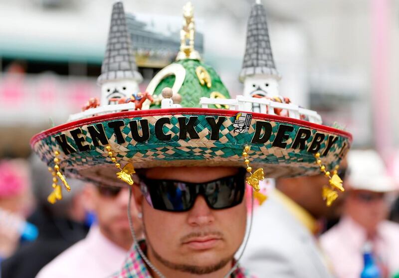 A race fan wearing a festive hat attends the 140th running of the Kentucky Oaks at Churchill Downs on May 2, 2014 in Louisville, Kentucky. Kevin C. Cox / Getty Images / AFP