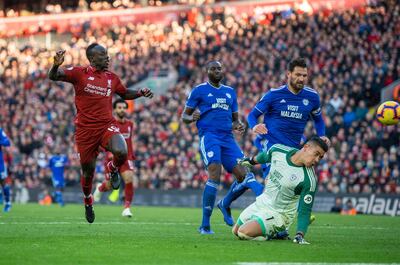 epa07124442 Liverpool's Sadio Mane scores the fifth goal making the score 4-1 during the English Premier League soccer match between Liverpool and Cardiff City at the Anfield in Liverpool, Britain, 27 October 2018.  EPA/PETER POWELL EDITORIAL USE ONLY. No use with unauthorized audio, video, data, fixture lists, club/league logos or 'live' services. Online in-match use limited to 75 images, no video emulation. No use in betting, games or single club/league/player publications