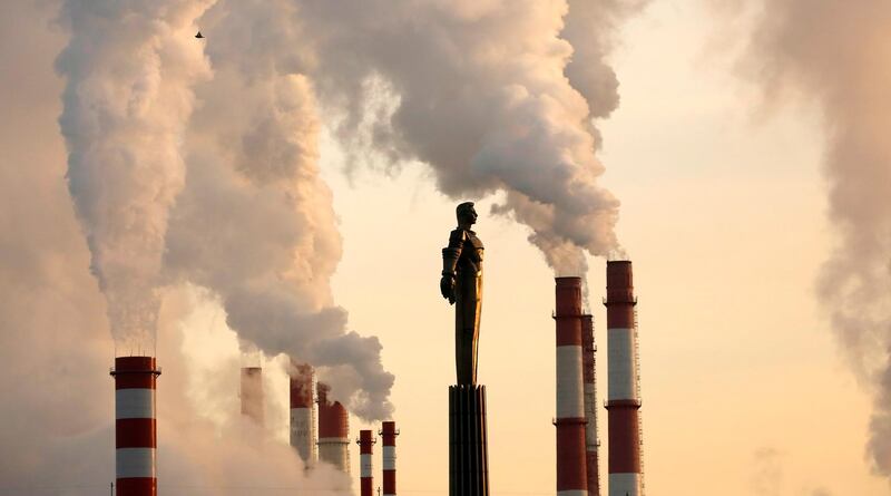 A thermoelectric power station emits smoke behind the monument of the first cosmonaut Yuri Gagarin, as the air temperature in the Russian capital fell to minus 18 degrees Celsius in Moscow, Russia.  EPA