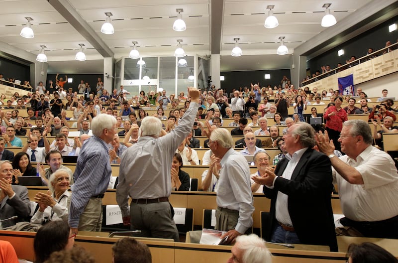 Scientists applaud after the discovery of the Higgs boson was announced on July 4, 2012. AFP