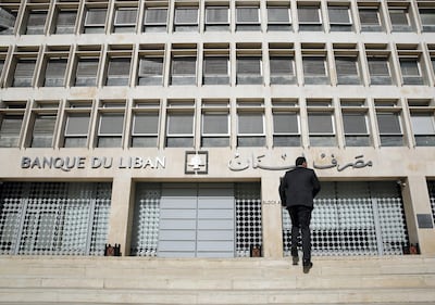 FILE - This Tuesday, Jan. 22, 2019 file photo, a man heads to the Lebanese central bank, in Beirut, Lebanon. The Beirut Stock Exchange said Monday, May 6, 2019, that it is suspending trading due to the open strike declared by the employees of Lebanon's central bank. Hundreds of Lebanese public employees are on strike amid concerns that their salaries and benefits might be cut as the government discusses an austerity budget. (AP Photo/Hussein Malla, File)