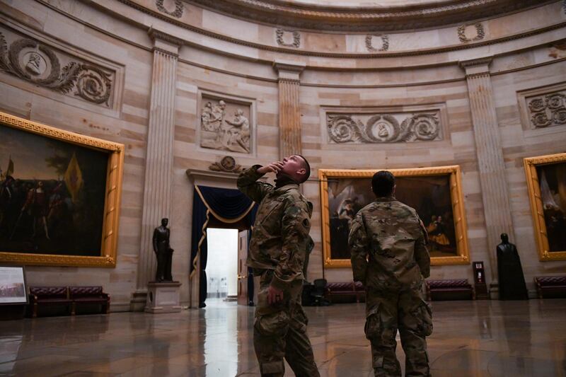 Members of the National Guard visit the US Capitol Rotunda. Reuters