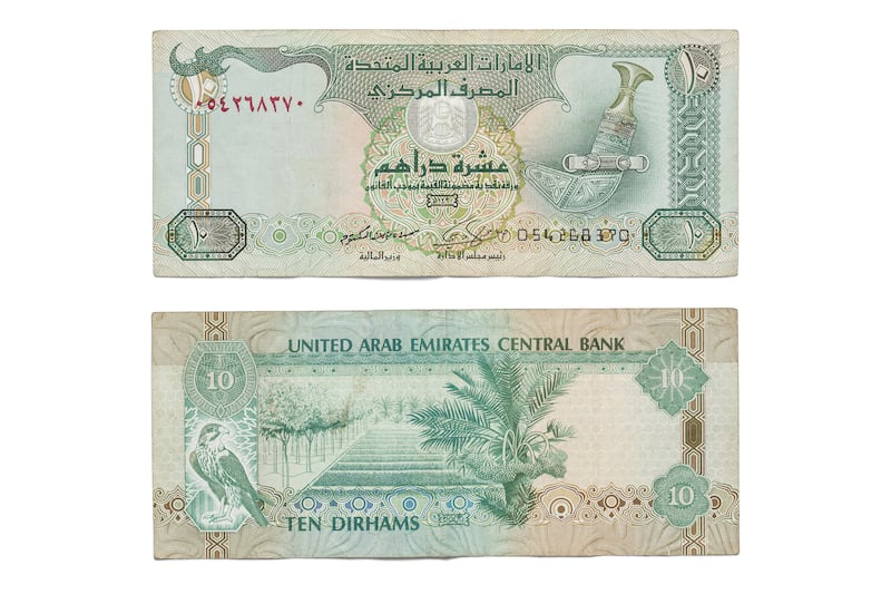 DUBAI, UNITED ARAB EMIRATES. 12 APRIL 2021. United Arab Emirates currency, UAE Money. Ten Dirham bank note, 10 aed. (Photo: Antonie Robertson/The National) Journalist: Juman Jarallah. Section: National.