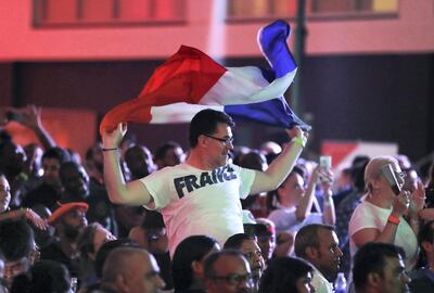 DUBAI , UNITED ARAB EMIRATES , JULY 15 – 2018 :- Supporters of France celebrating after France won the World Cup final match against Croatia at The Dome in Dubai Sports City in Dubai. ( Pawan Singh / The National )  For News. Story by Patrick