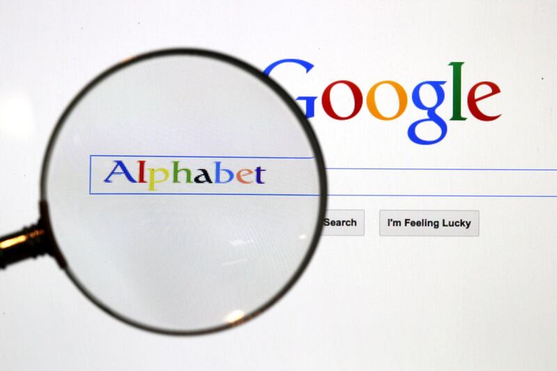 FILE PHOTO: A Google search page is seen through a magnifying glass in this photo illustration taken in Berlin, August 11, 2015.  REUTERS/Pawel Kopczynski/File Photo