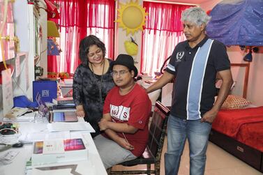 Pritvik Sinhadc with mother Indira Dharchaudhuri and father Bhaskar Sinha at their home in Jumeirah Village Circle in Dubai. Pawan Singh/ The National