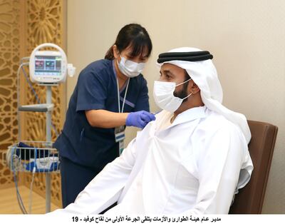 The director general of the National Emergency, Crisis and Disasters Management Authority, Obaid Al Shamsi, taking the vaccine. Wam