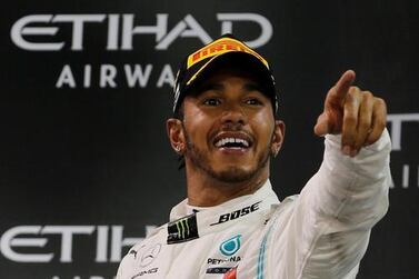 Lewis Hamilton celebrates after winning last season's Abu Dhabi GP. Reuters