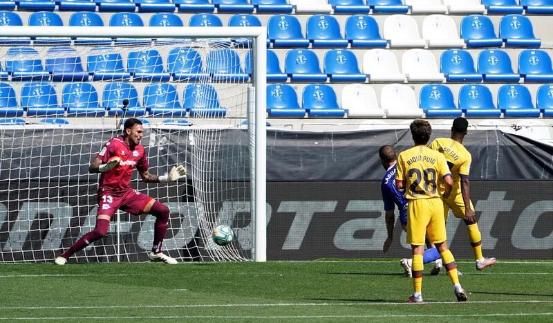 Barcelona's Ansu Fati scores the first goal against Alaves. Reuters