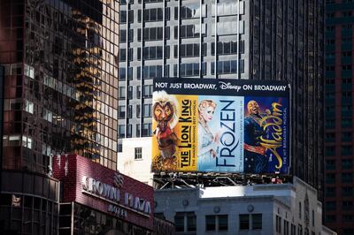 Billboards for Walt Disney Co. The Lion King, Frozen and Aladdin Broadway musicals stand on display in the Times Square area of New York, U.S., on Tuesday, May 12, 2020. New York City's lockdown is likely to continue into June, Mayor Bill de Blasio said Monday at a press briefing. The state has been under lockdown since March in an attempt to stop the spread of the novel coronavirus. Photographer: Demetrius Freeman/Bloomberg