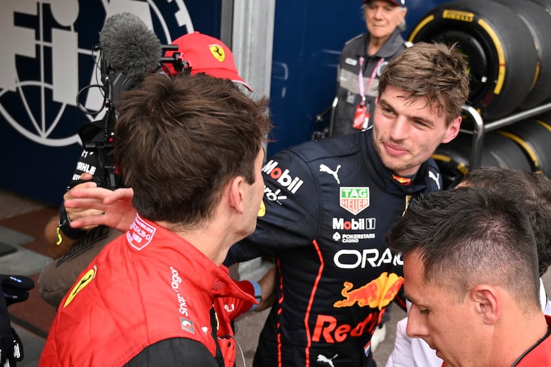 Ferrari driver Charles Leclerc of Monaco, left, is congratulated by Red Bull driver Max Verstappen. AP