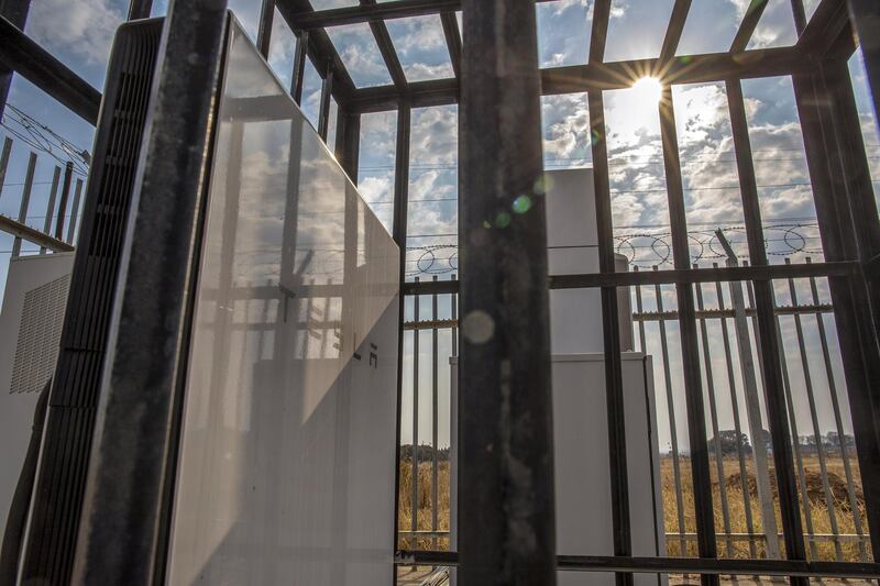 A Tesla Inc. Powerwall battery unit, installed by Distributed Power Africa, stands inside an Econet Wireless Ltd. telecommunications base station in Harare, Zimbabwe, on Tuesday, Aug. 20, 2019. Amid power outages of as long as 18 hours a day, Econet, Zimbabwe’s biggest mobile-phone operator, is turning to the Palo Alto, California-based automaker and storable-energy company for batteries that can keep its base stations running. Photographer: Cynthia R Matonhodze/Bloomberg