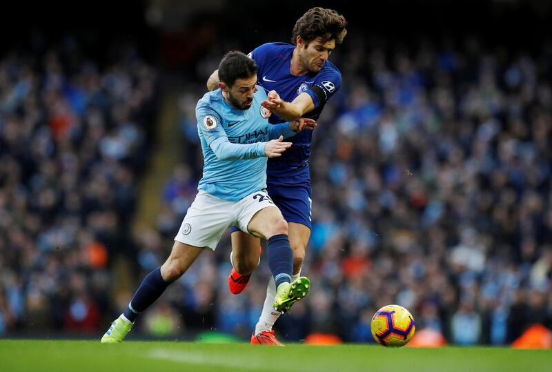 City's Bernardo Silva in action with Chelsea's Marcos Alonso. Reuters