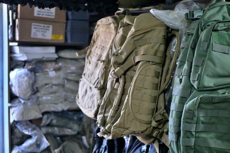 Pictured: Mustafa's shop sells army-style backpacks as well as US military-issued safety apparel such as flak jackets and helmets. 
Photo by Charlie Faulkner