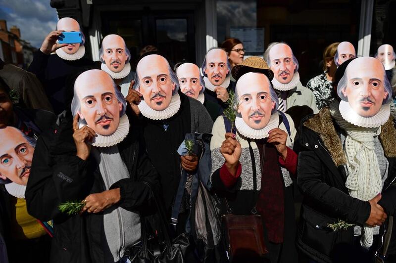 Wearing masks of the “Bard of Avon”, members of the public prepare for the parade marking the 400 years since the death of William Shakespeare, in Stratford-upon-Avon in central England.  William Shakespeare’s hometown of Stratford-upon-Avon leads the global celebrations to mark 400 years since the playwright’s death, with enough star-studded plays, concerts and parades to bring the town to a standstill. Leon Neal / AFP