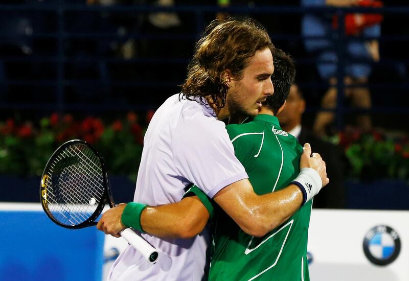 Novak Djokovic embraces Stefanos Tsitsipas after winning the final. Reuters