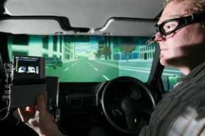 SYDNEY, AUSTRALIA. 20 MAY 2009: David Bosanquet, from the University of Sydney demonstrates a driving simulator used to test the effects that drugs have on driving skills May 20, 2009 in Sydney, Australia.  (Photo by Ian Waldie.)  *** Local Caption ***  IW_Drug_Driving_005.jpg