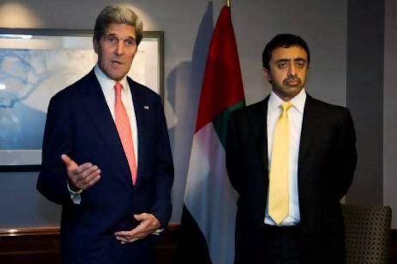 Foreign Minister Sheikh Abdullah bin Zayed meets with US Secretary of State John Kerry in London yesterday. Jason Reed / Reuters