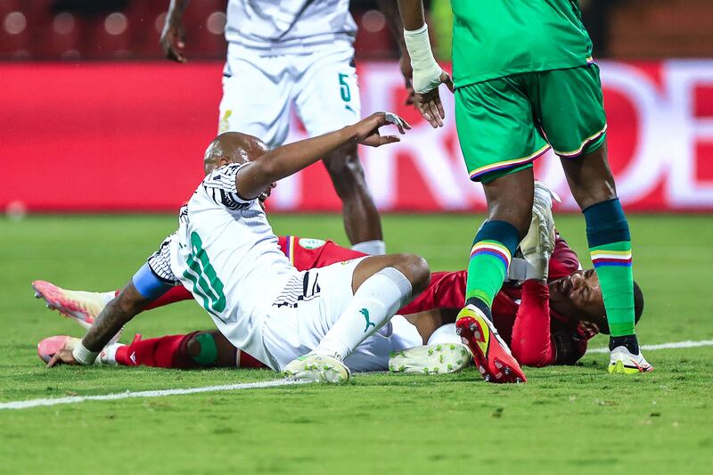 Ghana forward Andre Ayew collides with Comoros goalkeeper Salim Ben Boina leading to a foul and a red card for Ayew. AFP