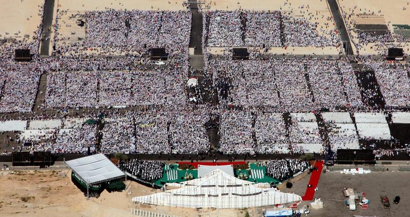 An aerial view shows crowds attending a mass held by Pope Benedict XVI in the Lebanese capital Beirut on September 16, 2012. Pope Benedict XVI prayed that Middle East leaders work toward peace and reconciliation, stressing again the central theme of his visit to Lebanon, whose neighbour Syria is engulfed in a civil war. AFP PHOTO/POOL/BILAL HUSSEIN (Photo by BILAL HUSSEIN / POOL / AFP)