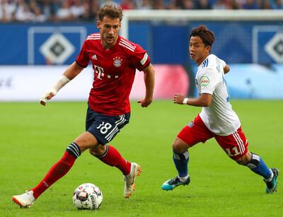 epa06951433 Leon Goretzka (L) of Bayern Munich in action against Hamburg's Tatsuya Ito (R) during the friendly soccer match between Hamburger SV and Bayern Munich in Hamburg, Germany, 15 August 2018.  EPA/SRDJAN SUKI