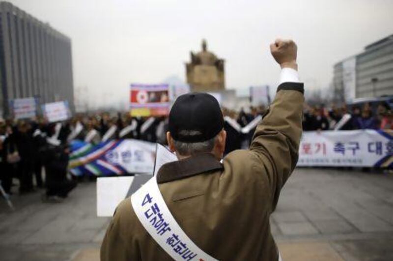 A South Korean protester at a rally demanding the Korean Peninsula's peaceful unification and denouncing North Korea's nuclear test near the US Embassy in Seoul on Monday. Lee Jin-man / AP Photo