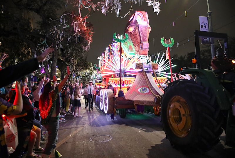 People cheer as the Krewe of Orpheus rolls through New Orleans before Mardi Gras. AP